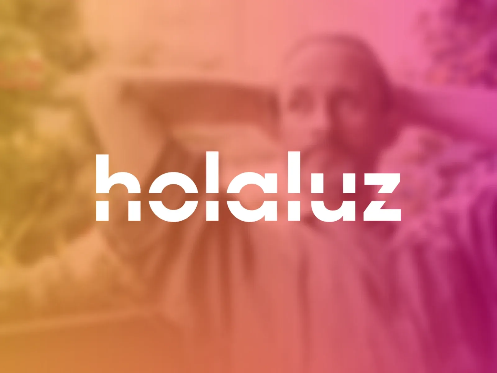 The Holaluz logo in white over a warm orange-to-pink photo of a man relaxing among plants