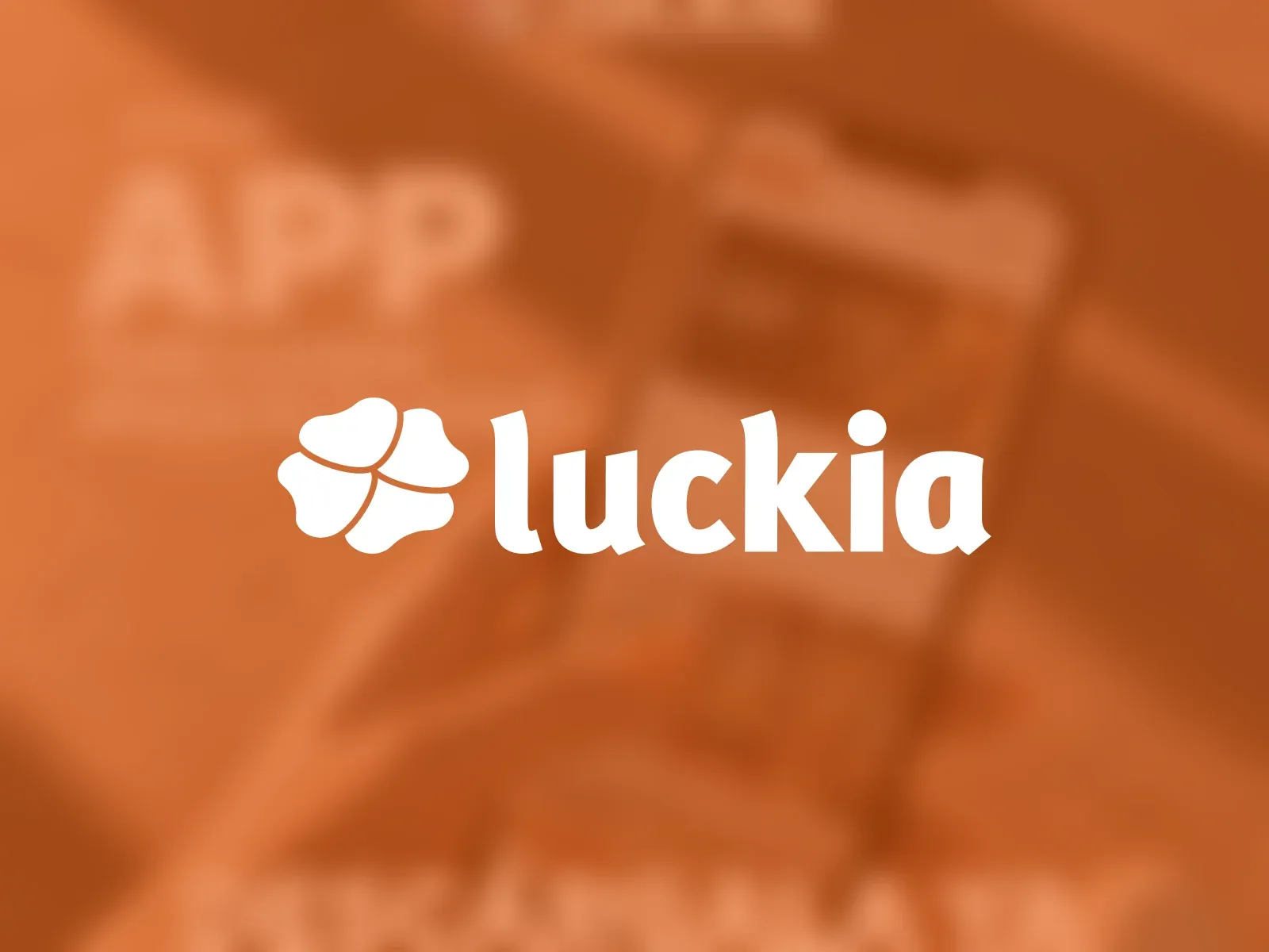The Luckia logo in white over a blurred hand holding a phone, in Luckia orange